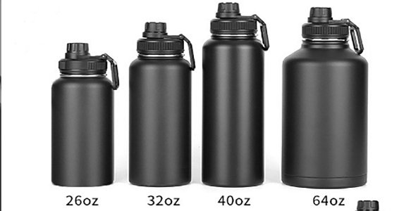 A person trying to fit a large 32 oz water bottle into a standard car cup holder.