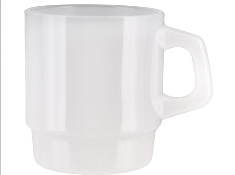 A close-up shot of a milk glass mug showcasing its smooth, opaque, and milky texture.