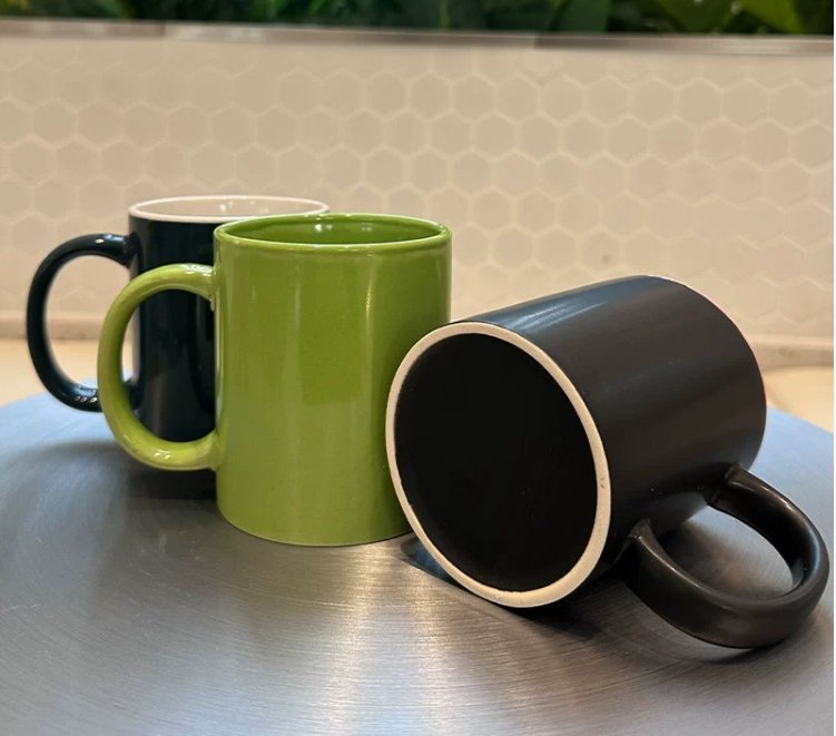 a rustic, sturdy-looking stoneware mug next to a more standard, plain white ceramic mug