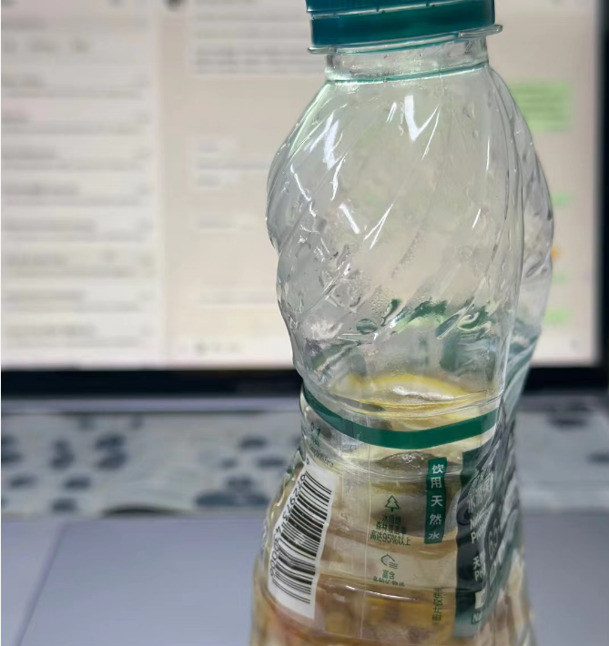 a clear disposable plastic bottle slightly warping from the heat of the water inside