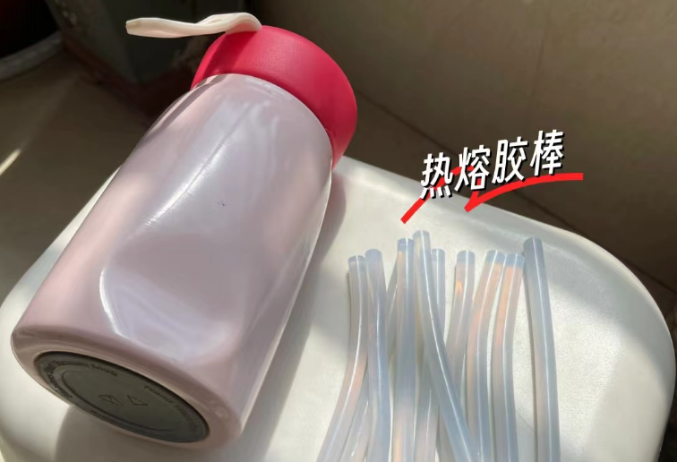 a stainless steel water bottle with a large, noticeable dent on its side