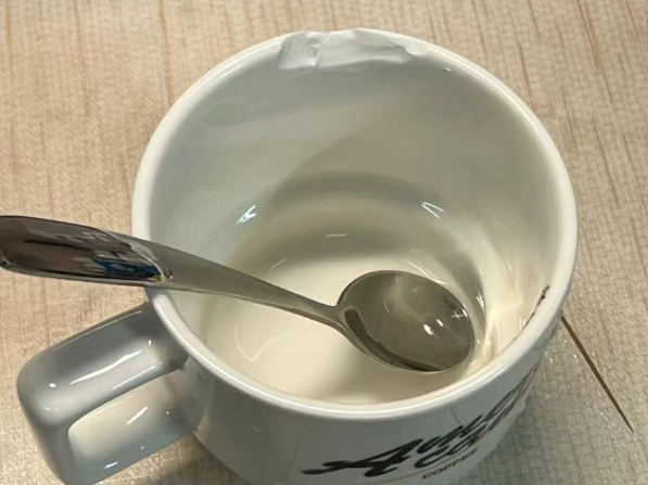 a well-loved ceramic mug with a noticeable chip on its rim