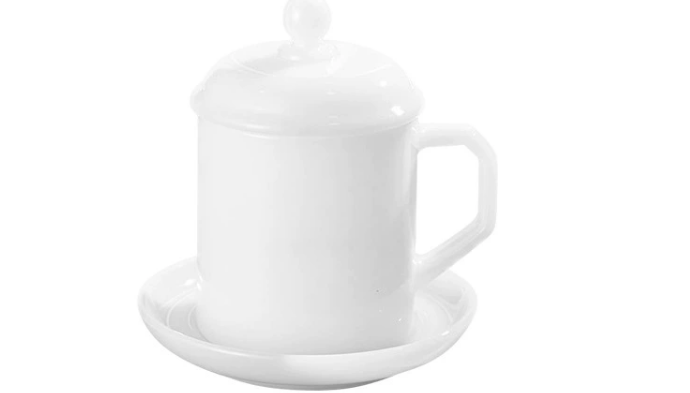 a person holding a milk glass vase up to a window, revealing a subtle glow