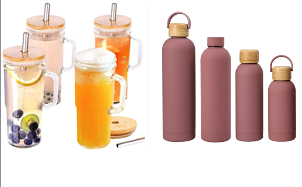 a glass water bottle and a stainless steel water bottle side-by-side on a kitchen counter