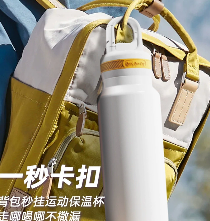 a person carrying a stainless steel water bottle in a backpack during a city commute